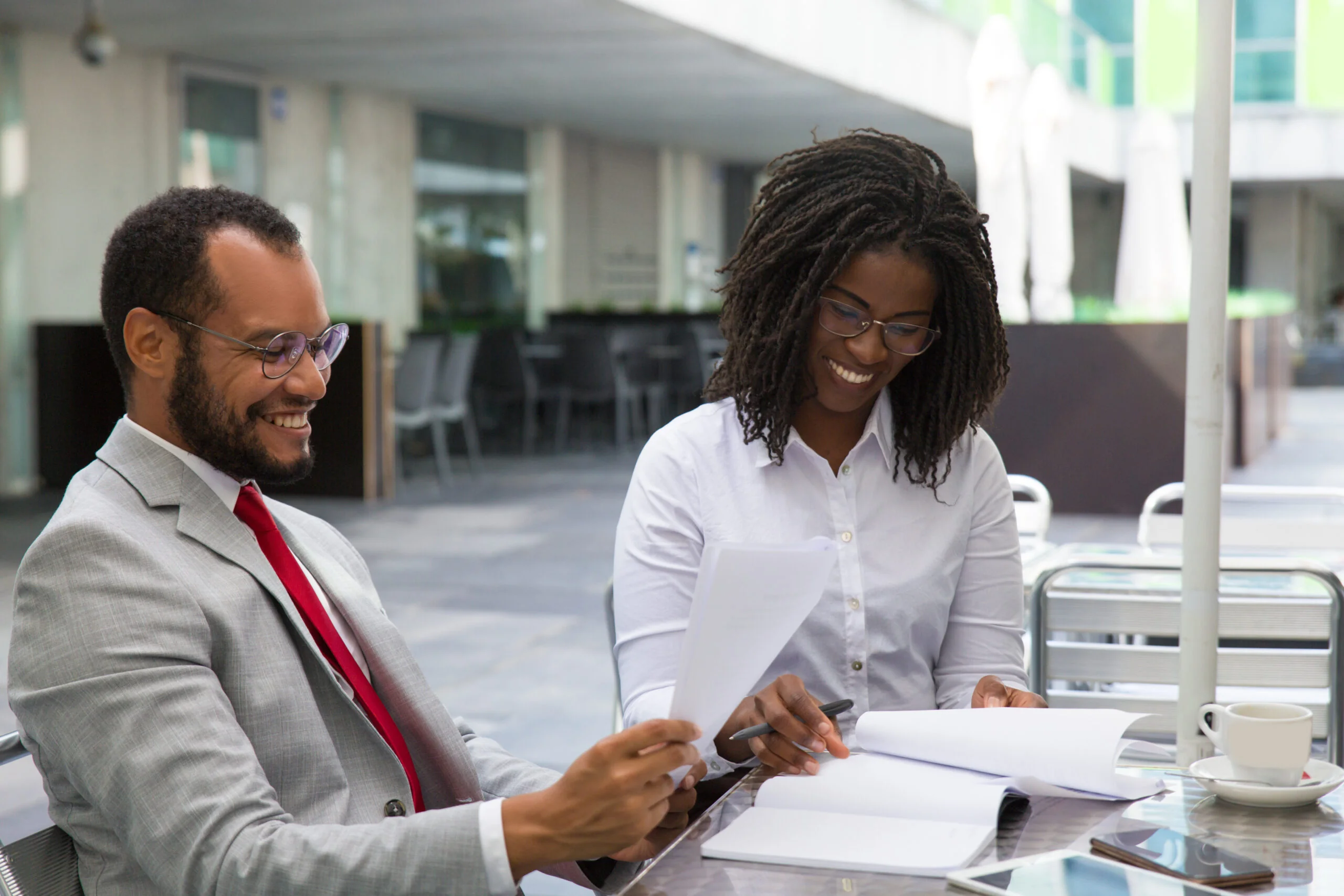 Business colleagues reviewing reports together in a meeting